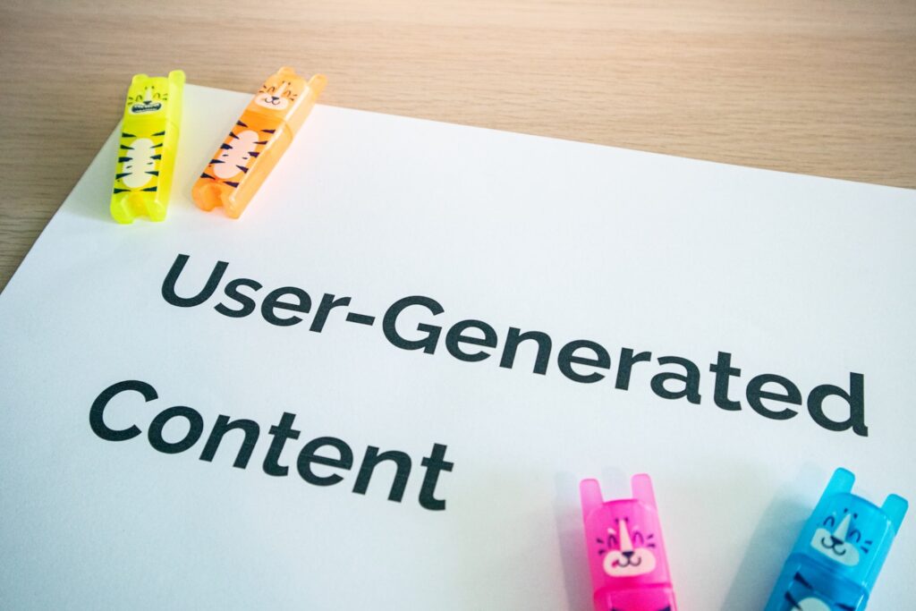 Desk with a paper with the words User-Generated Content on it and stationary elements