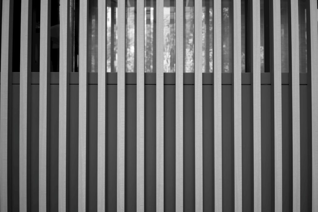 Abstract black and white pattern of vertical lines.